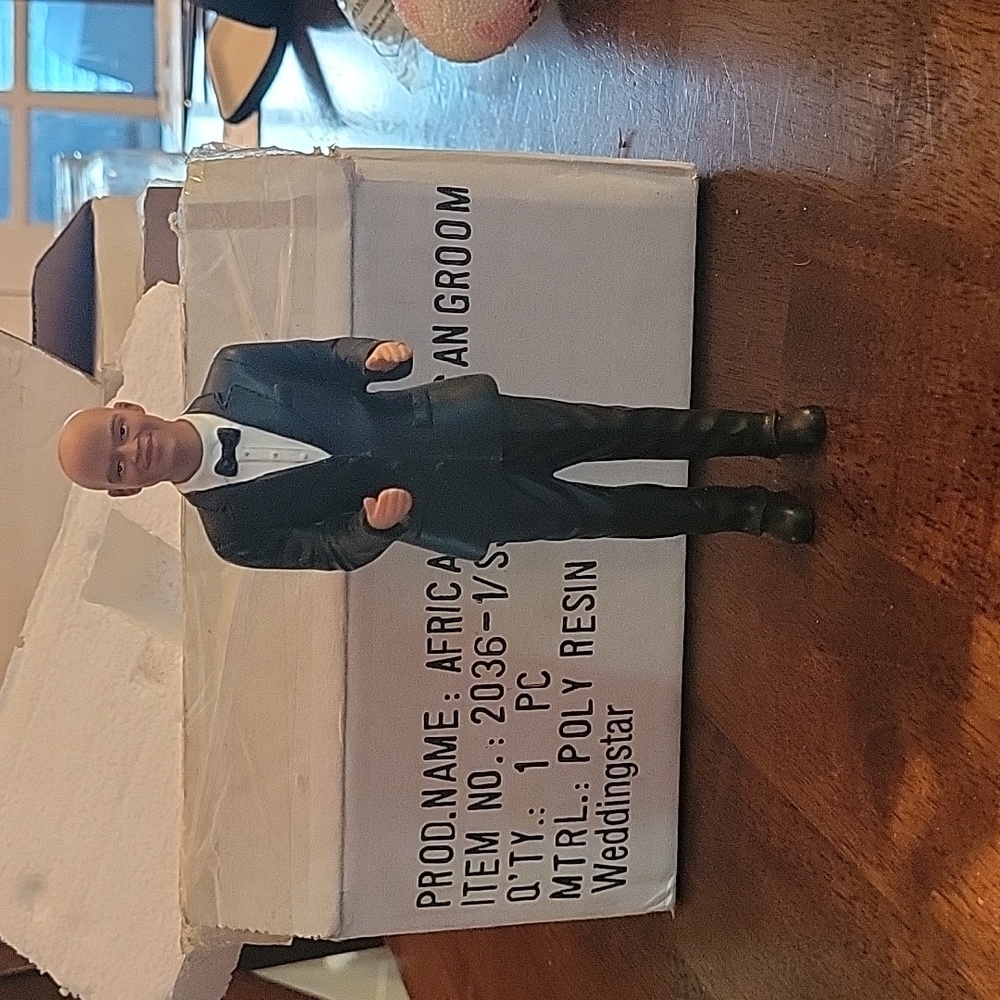 Cake topper African American groom. Bald in a tux